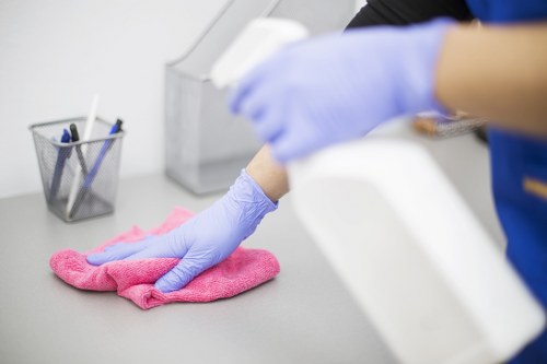 Cleaner preparing a service booking and quote paperwork